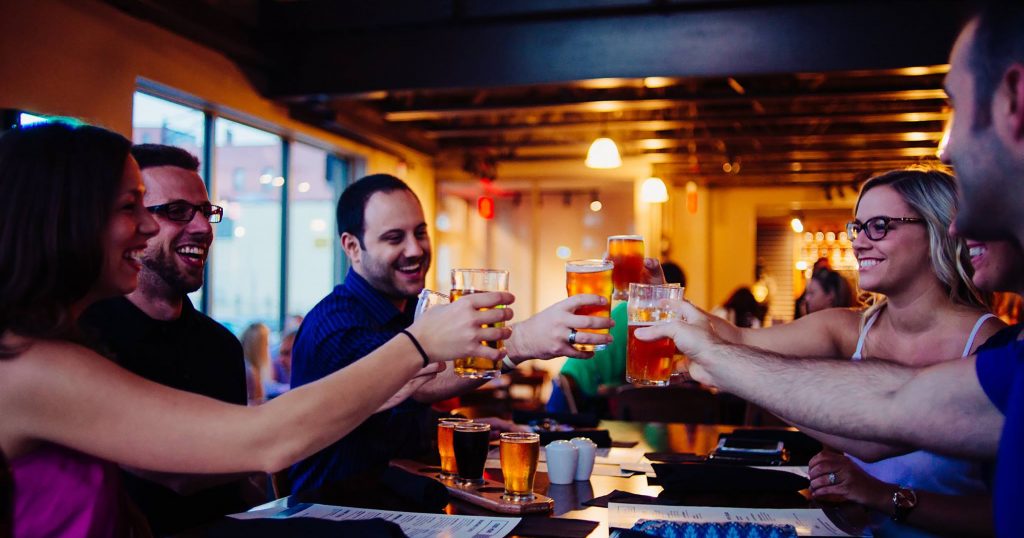Group cheering beer at Big Ditch Brewing