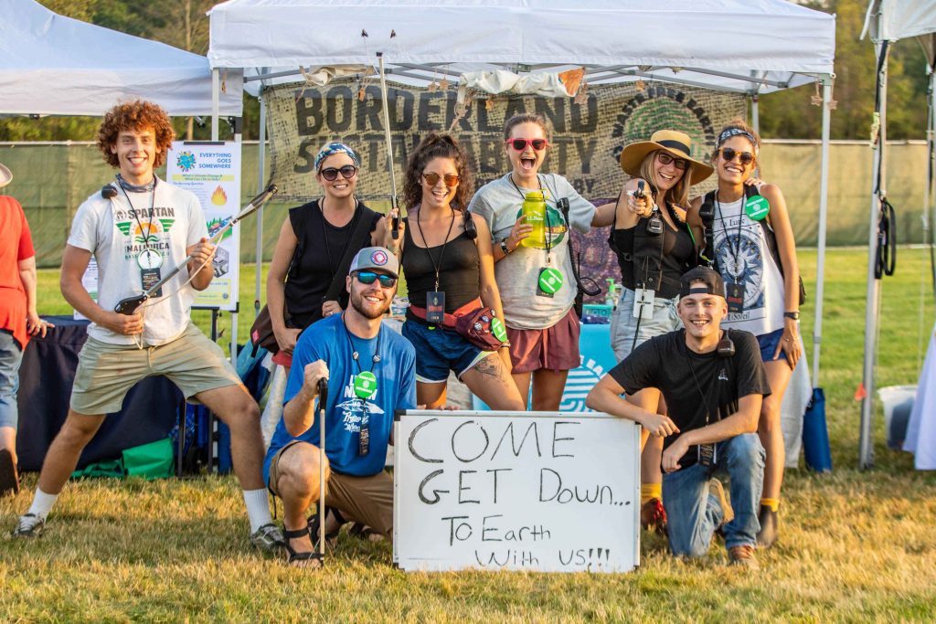 A photo of a group of volunteers helping to clean up the grounds of Knox Farm State Park at Borderland Music + Arts Festival.