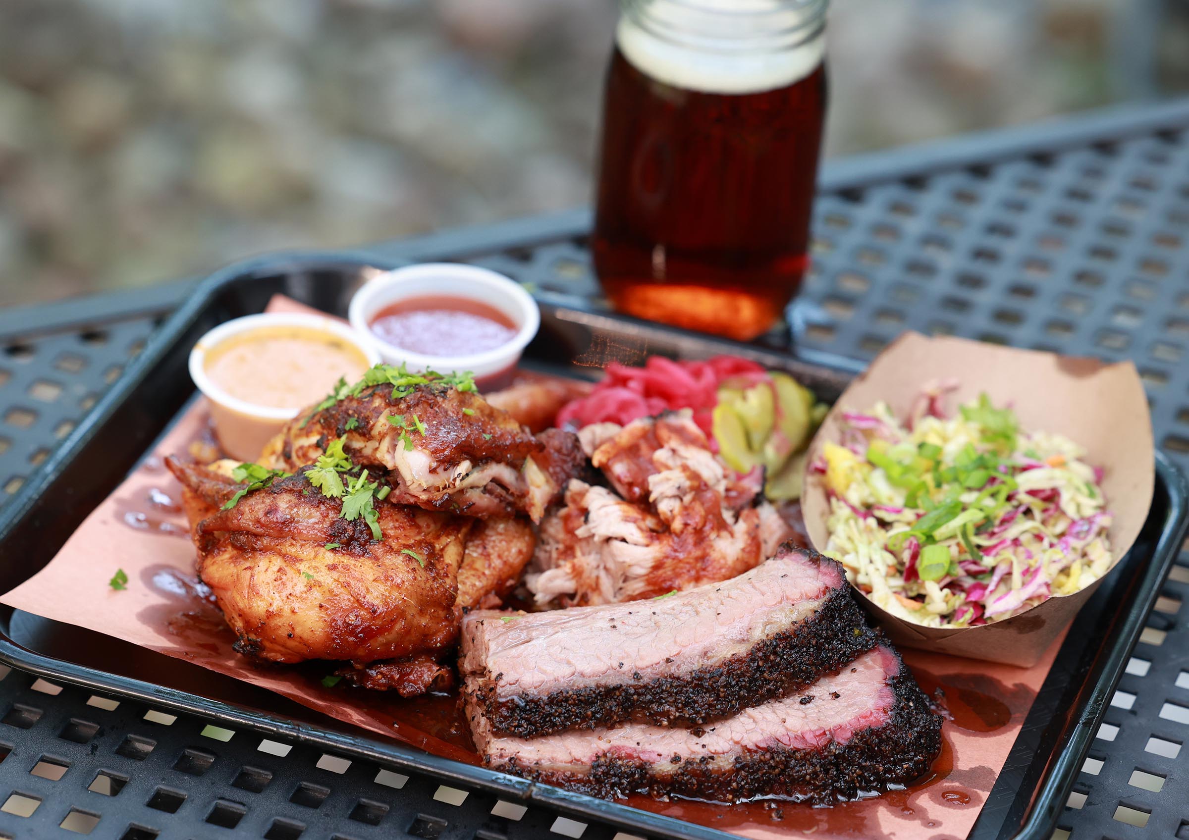 Southern Junction just opened at its new location at 365 Connecticut St. in Buffalo. This is a sampling of some of their meats and sides, Thursday Aug. 3, 2023. There is chicken, pulled pork beef brisket, mango slaw and sweet pickled red onions. Photo by Sharon Cantillon.