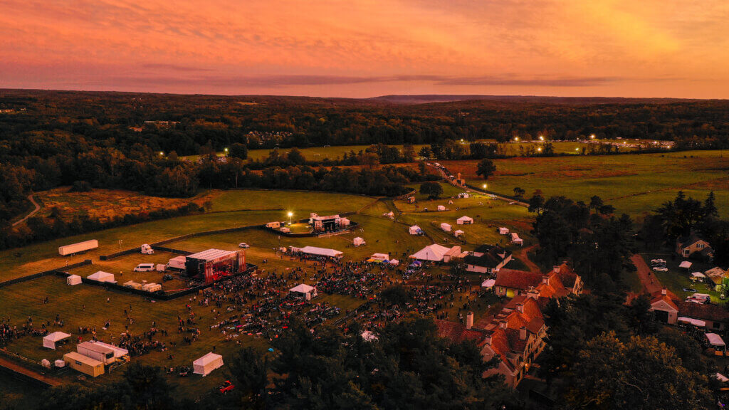 An aerial photo of a sunset over Borderland Music + Arts Festival and Knox Farm State Park.